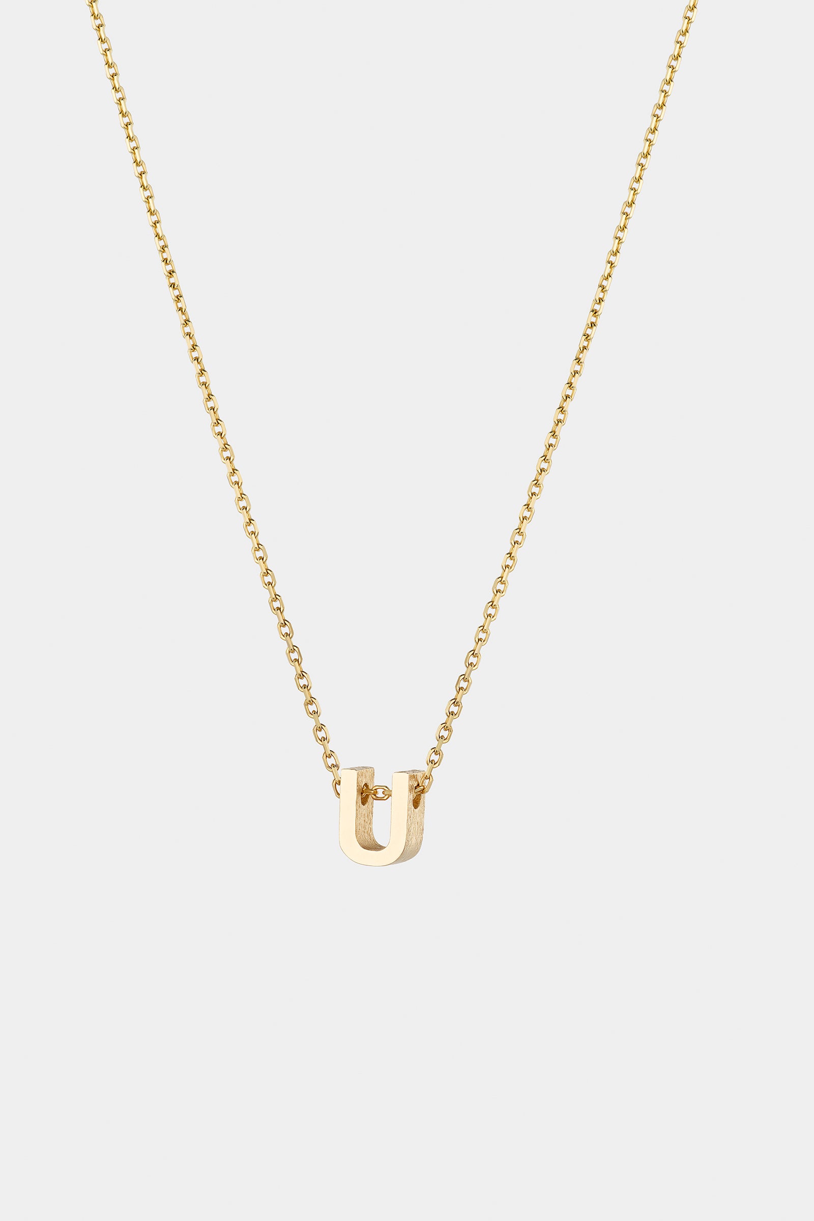 THE LETTER AUKSINĖ GRANDINĖLĖ SU DIDESNIU RAIDELĖS PAKABUKU