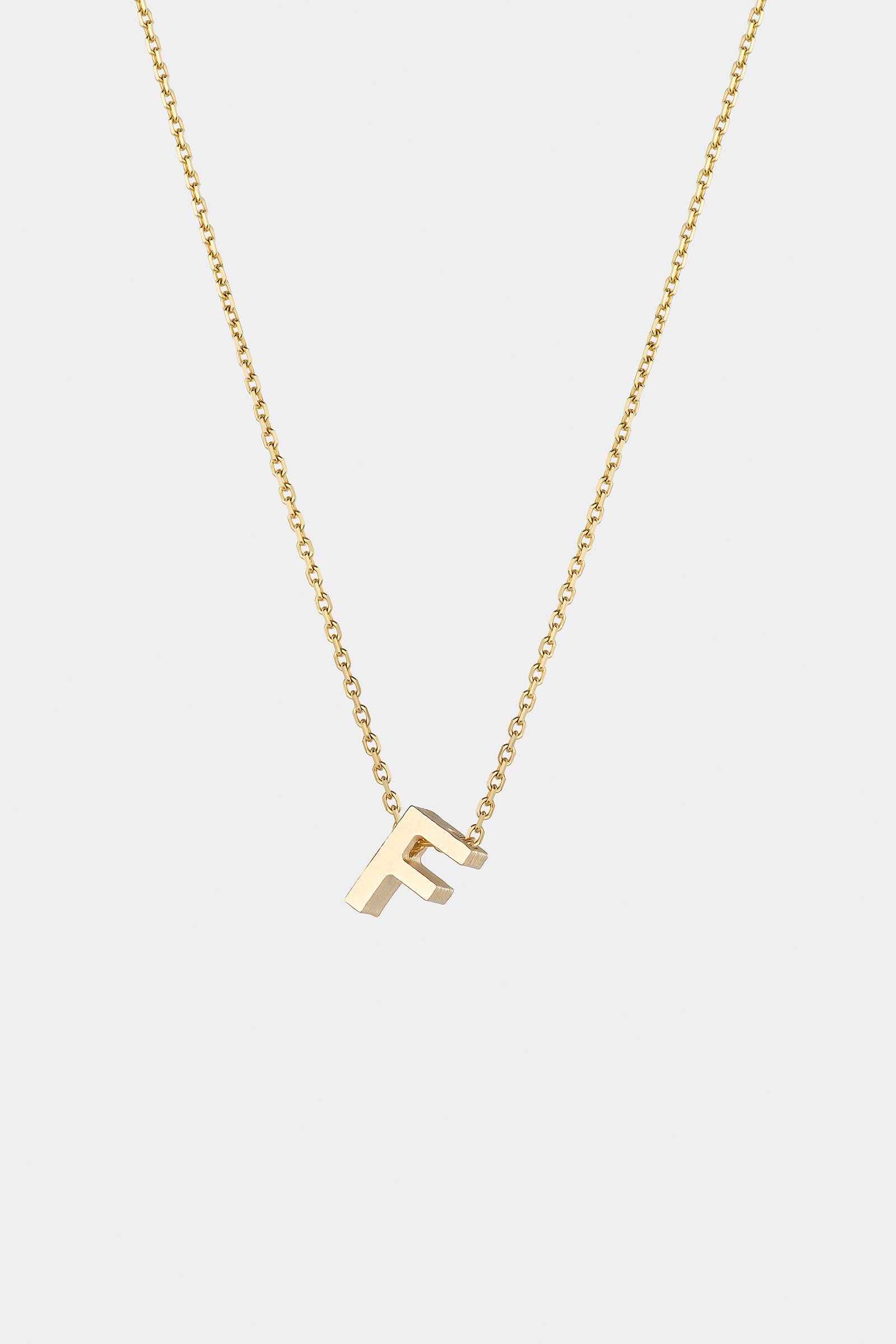 THE LETTER AUKSINĖ GRANDINĖLĖ SU DIDESNIU RAIDELĖS PAKABUKU