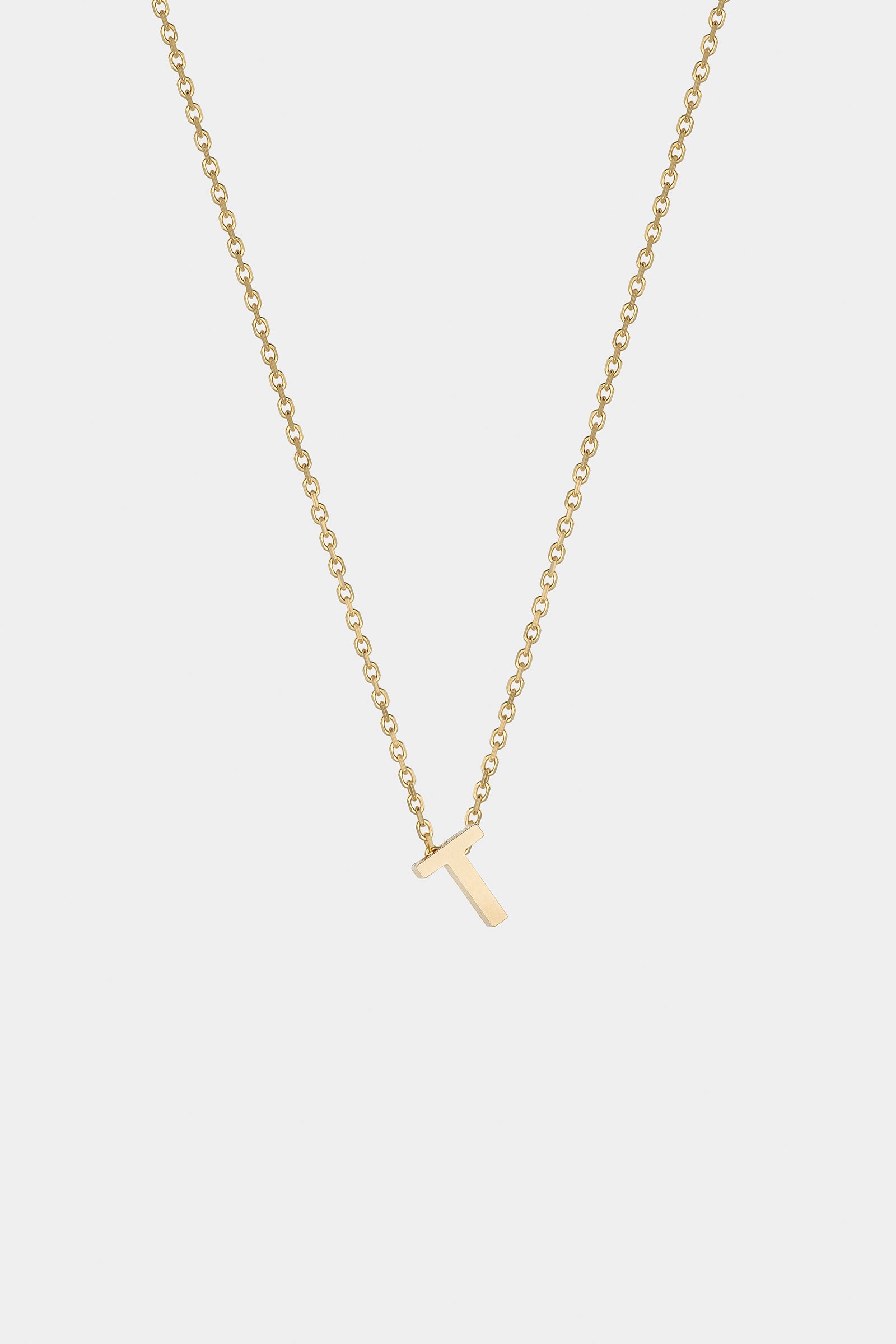 THE LETTER AUKSINĖ GRANDINĖLĖ SU DIDESNIU RAIDELĖS PAKABUKU